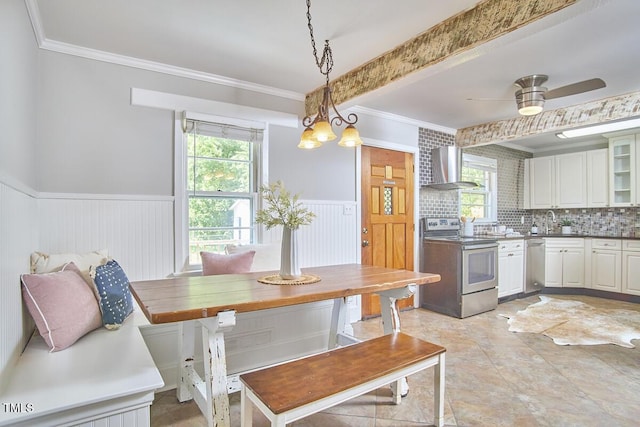 2616 Kirk Rd, Durham, NC 27705 - dining room featuring a wainscoted wall, ornamental molding, and a ceiling fan