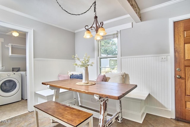 2616 Kirk Rd, Durham, NC 27705 - dining area featuring washer / dryer, a wainscoted wall, ornamental molding, tile patterned floors, and breakfast area