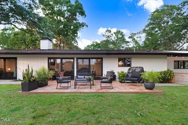 500 Walnut Creek Dr, Goldsboro, NC 27534 - back of property with a patio area, a chimney, a yard, and an outdoor hangout area