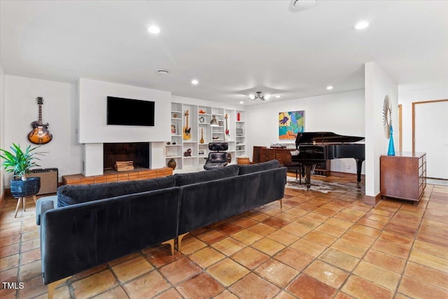 500 Walnut Creek Dr, Goldsboro, NC 27534 - living room with recessed lighting, built in features, and a fireplace with raised hearth