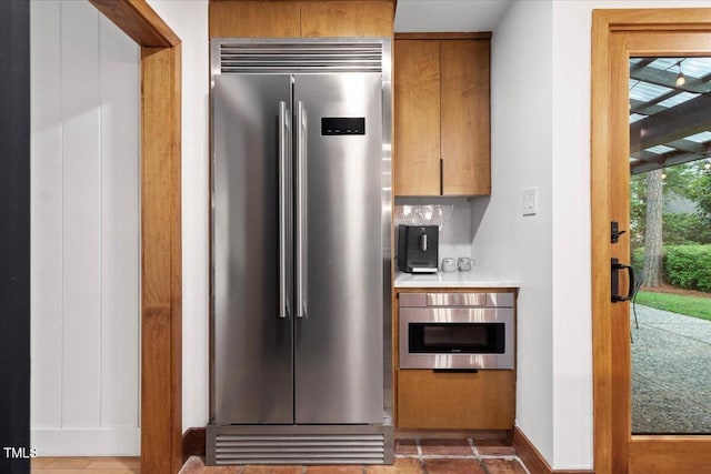 500 Walnut Creek Dr, Goldsboro, NC 27534 - kitchen featuring high end refrigerator, baseboards, and light countertops