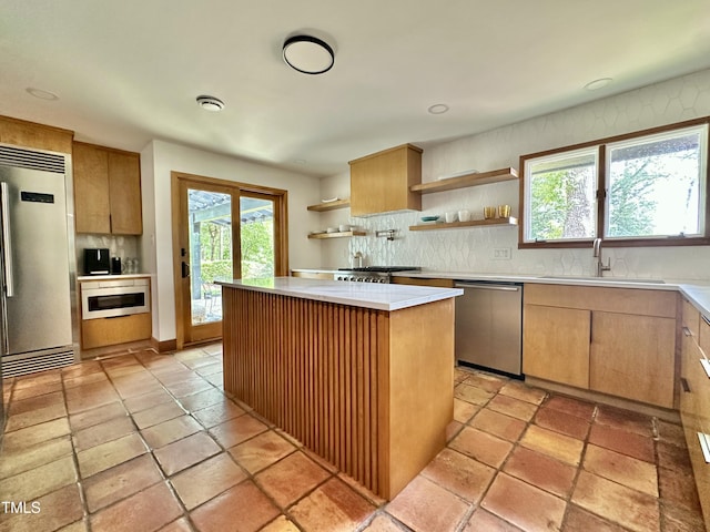 500 Walnut Creek Dr, Goldsboro, NC 27534 - kitchen with refrigerator, stainless steel dishwasher, open shelves, a sink, and backsplash