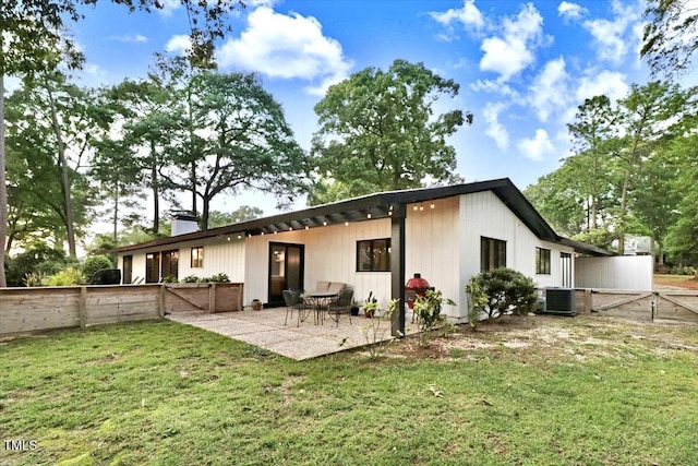 500 Walnut Creek Dr, Goldsboro, NC 27534 - rear view of property with a patio, central AC, and a chimney