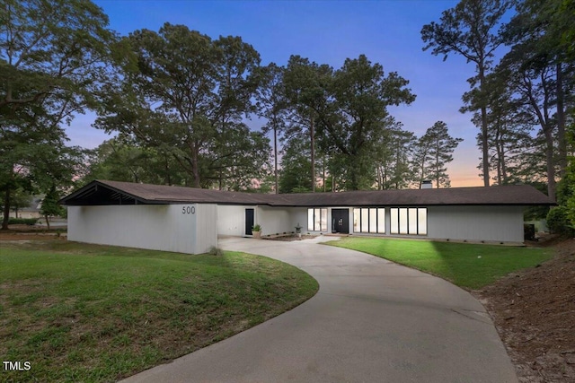 500 Walnut Creek Dr, Goldsboro, NC 27534 - mid-century modern home with concrete driveway and a yard