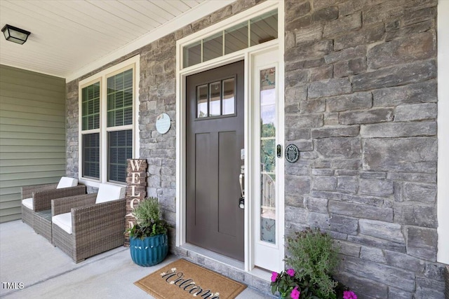 7801 Charters End St, Willow Springs, NC 27592 - doorway to property with stone siding and covered porch