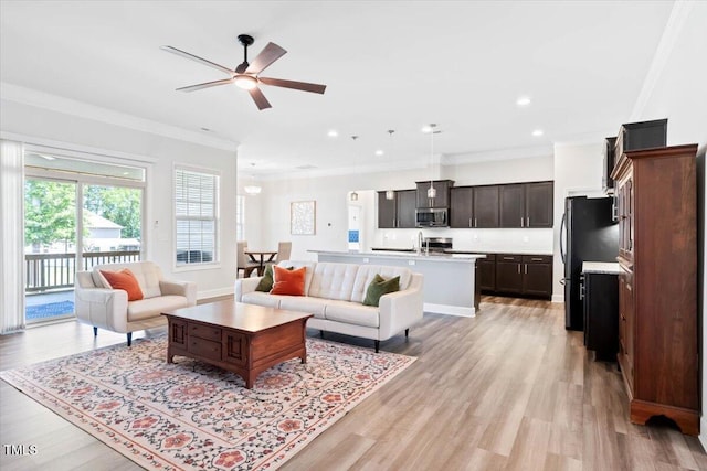 7801 Charters End St, Willow Springs, NC 27592 - living room with ornamental molding, ceiling fan, light wood finished floors, recessed lighting, and baseboards