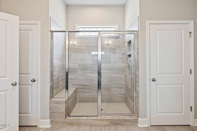 7801 Charters End St, Willow Springs, NC 27592 - bathroom featuring a shower stall and baseboards