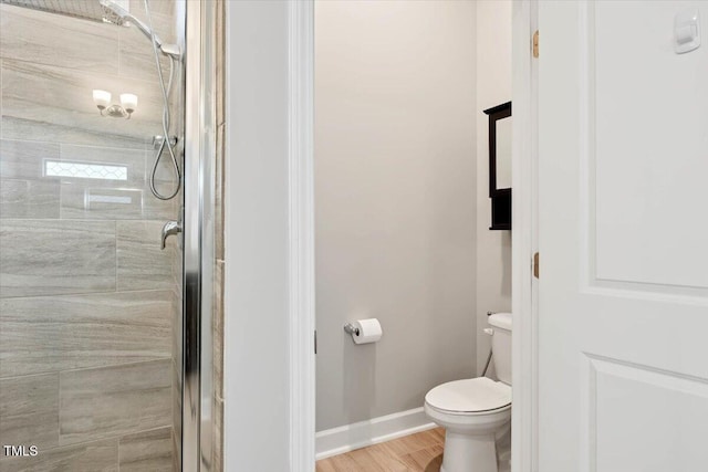 7801 Charters End St, Willow Springs, NC 27592 - full bath with a stall shower, toilet, baseboards, and wood finished floors