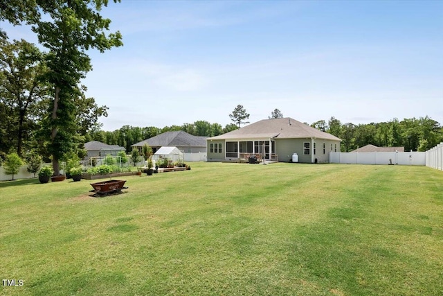 7801 Charters End St, Willow Springs, NC 27592 - back of property featuring an outdoor fire pit