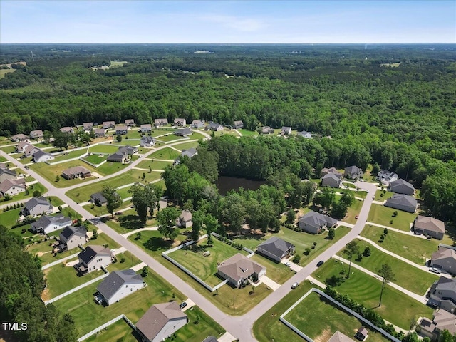 7801 Charters End St, Willow Springs, NC 27592 - aerial view of property and surrounding area featuring a forest and nearby suburban area