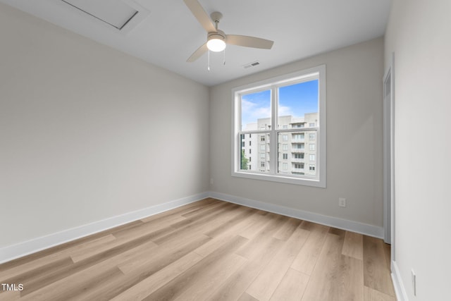 710 W N St Unit 101, Raleigh, NC 27603 - unfurnished room featuring light wood-style flooring, baseboards, and a ceiling fan