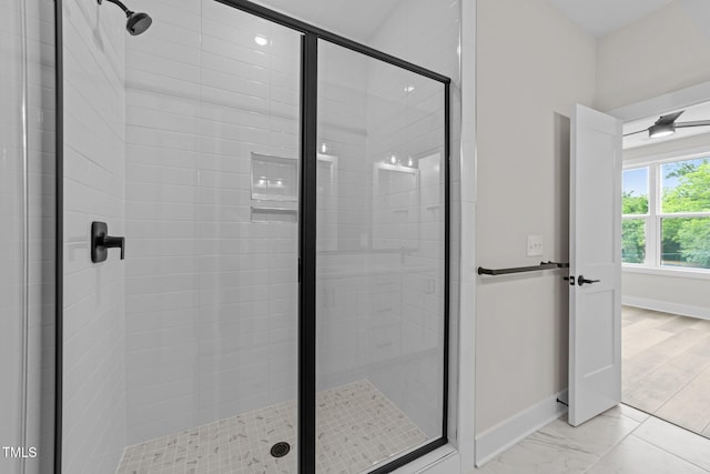 710 W N St Unit 101, Raleigh, NC 27603 - bathroom featuring a stall shower and baseboards