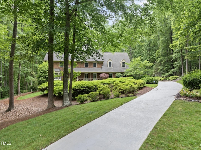 2300 Valley Forge Dr, Raleigh, NC 27615 - view of front of house with a front yard, driveway, and brick siding