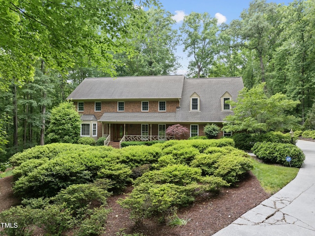 2300 Valley Forge Dr, Raleigh, NC 27615 - view of front of house featuring a porch and brick siding