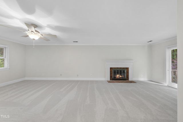2300 Valley Forge Dr, Raleigh, NC 27615 - unfurnished living room featuring light colored carpet, plenty of natural light, crown molding, ceiling fan, and a fireplace