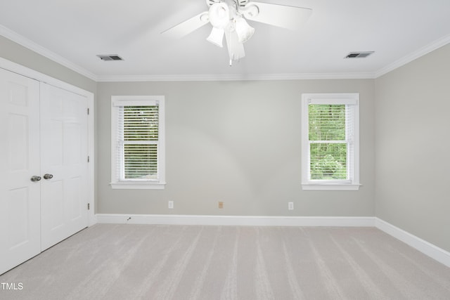 2300 Valley Forge Dr, Raleigh, NC 27615 - unfurnished bedroom featuring ornamental molding, light carpet, a closet, and a ceiling fan