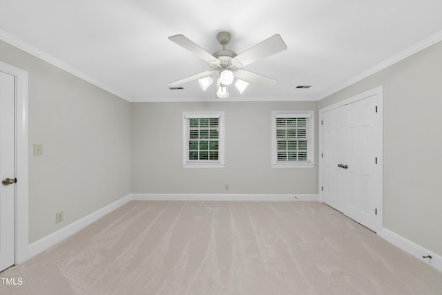 2300 Valley Forge Dr, Raleigh, NC 27615 - spare room with ornamental molding, light colored carpet, and a ceiling fan