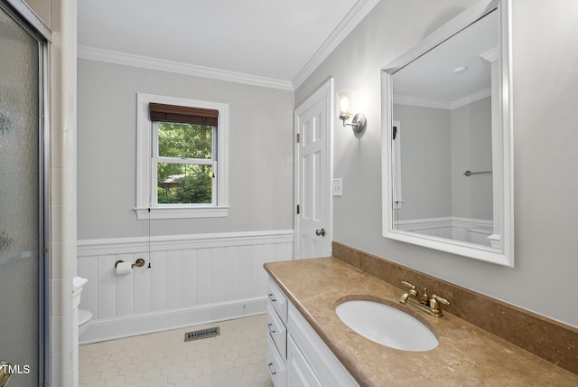 2300 Valley Forge Dr, Raleigh, NC 27615 - bathroom featuring vanity, ornamental molding, an enclosed shower, wainscoting, and tile patterned flooring