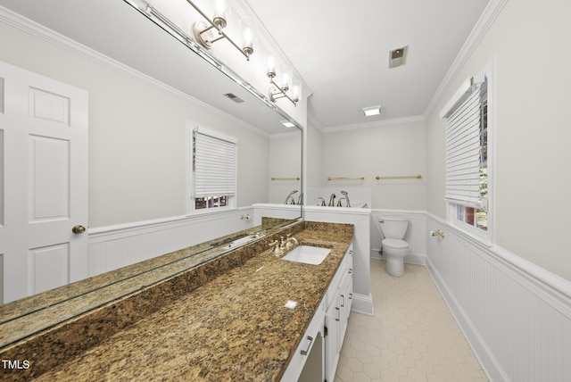 2300 Valley Forge Dr, Raleigh, NC 27615 - bathroom with wainscoting, vanity, crown molding, tile patterned floors, and a decorative wall