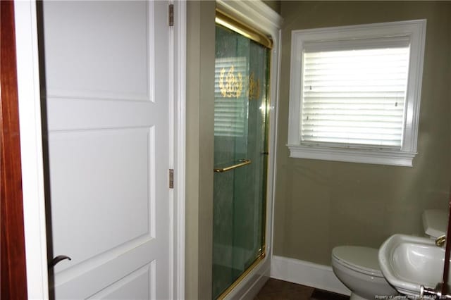 706 Riverside Dr, Lumberton, NC 28358 - full bathroom featuring a stall shower, toilet, and baseboards
