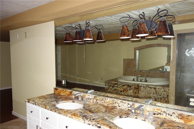 706 Riverside Dr, Lumberton, NC 28358 - full bathroom featuring double vanity, a bath, baseboards, tile patterned floors, and a shower stall