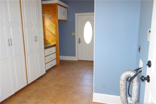 706 Riverside Dr, Lumberton, NC 28358 - foyer entrance with baseboards and light tile patterned flooring