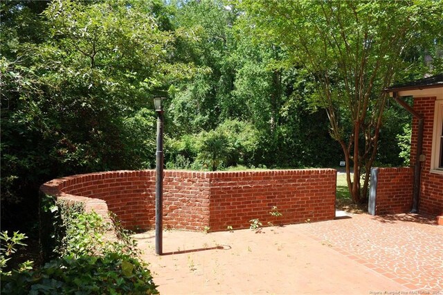 706 Riverside Dr, Lumberton, NC 28358 - gate with a patio