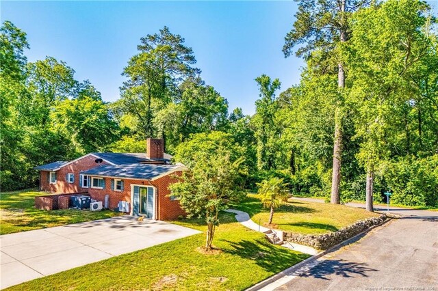706 Riverside Dr, Lumberton, NC 28358 - view of front of property featuring a front lawn and a chimney