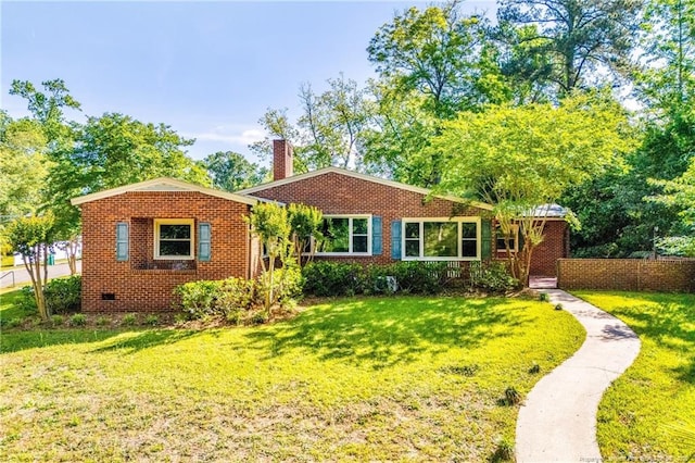 706 Riverside Dr, Lumberton, NC 28358 - view of front of home with a front yard, a chimney, and brick siding