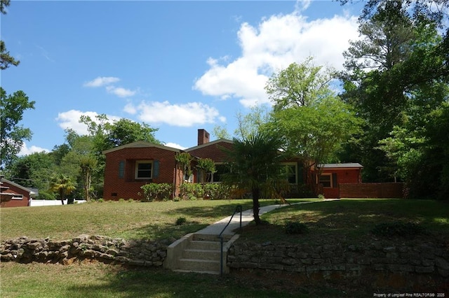 706 Riverside Dr, Lumberton, NC 28358 - ranch-style home with a chimney, a front lawn, and brick siding