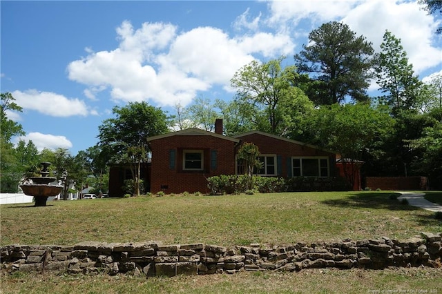 706 Riverside Dr, Lumberton, NC 28358 - view of front facade featuring a front lawn, a chimney, and brick siding