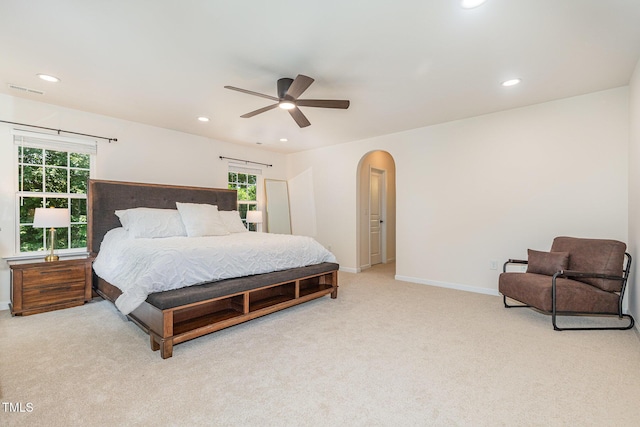 233 Hammond Wood Pl, Morrisville, NC 27560 - bedroom with arched walkways, carpet flooring, recessed lighting, baseboards, and ceiling fan