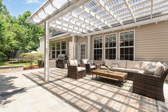 233 Hammond Wood Pl, Morrisville, NC 27560 - view of patio featuring a trampoline, outdoor lounge area, a pergola, and grilling area