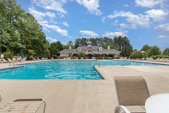 233 Hammond Wood Pl, Morrisville, NC 27560 - community pool featuring a patio area and view of scattered trees