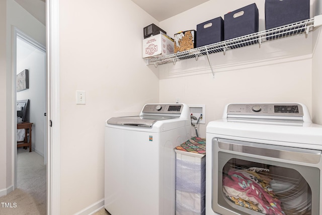 233 Hammond Wood Pl, Morrisville, NC 27560 - washroom featuring washing machine and dryer, baseboards, and light carpet