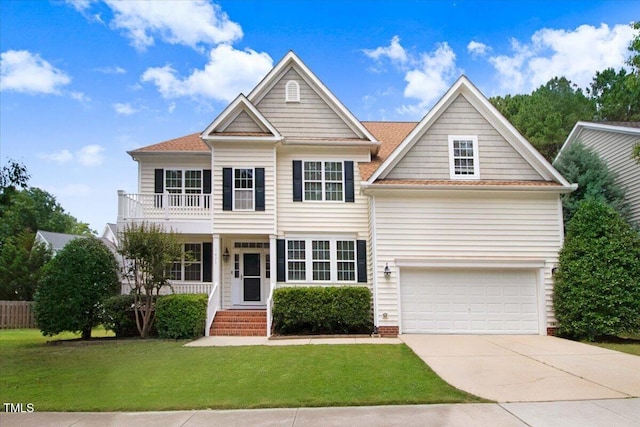 1420 Lagerfeld Way, Wake Forest, NC 27587 - view of front of house featuring a balcony, an attached garage, a front yard, and concrete driveway
