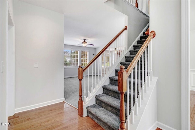 1420 Lagerfeld Way, Wake Forest, NC 27587 - stairway featuring a ceiling fan, baseboards, and wood finished floors