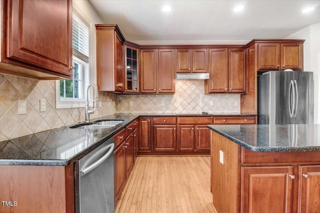 1420 Lagerfeld Way, Wake Forest, NC 27587 - kitchen featuring stainless steel appliances, a sink, healthy amount of natural light, light wood-type flooring, and recessed lighting
