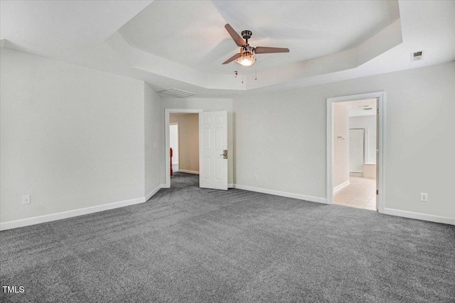 1420 Lagerfeld Way, Wake Forest, NC 27587 - unfurnished bedroom featuring a raised ceiling, carpet, and baseboards
