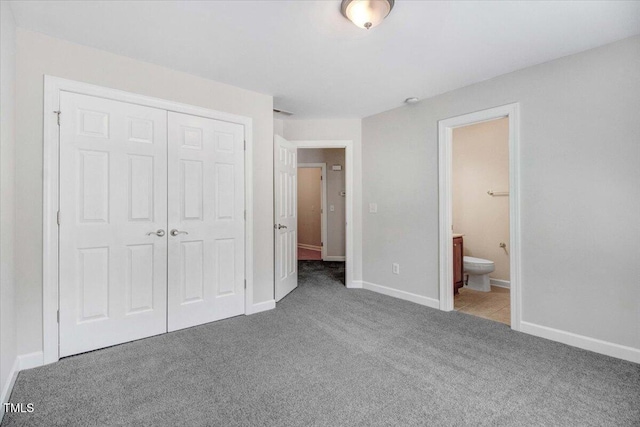 1420 Lagerfeld Way, Wake Forest, NC 27587 - unfurnished bedroom featuring carpet flooring, a closet, baseboards, and ensuite bath