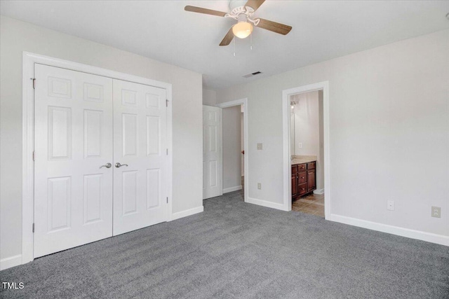 1420 Lagerfeld Way, Wake Forest, NC 27587 - unfurnished bedroom with carpet flooring, a closet, baseboards, ceiling fan, and connected bathroom