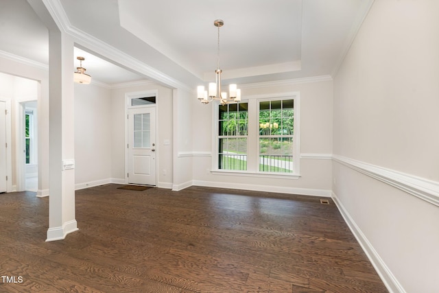 66 Sweet Meadow Ln, Pittsboro, NC 27312 - unfurnished dining area with a chandelier, a raised ceiling, dark wood-style flooring, baseboards, and ornamental molding