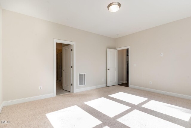 66 Sweet Meadow Ln, Pittsboro, NC 27312 - unfurnished bedroom with light carpet and baseboards