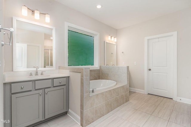 66 Sweet Meadow Ln, Pittsboro, NC 27312 - full bathroom with vanity, a garden tub, baseboards, and tile patterned flooring