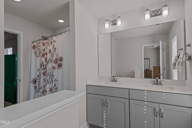 518 Toran Dr, Wake Forest, NC 27587 - full bathroom with double vanity, healthy amount of natural light, and curtained shower