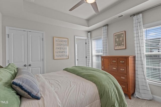 518 Toran Dr, Wake Forest, NC 27587 - bedroom featuring carpet floors, a closet, a tray ceiling, and ceiling fan