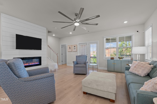 518 Toran Dr, Wake Forest, NC 27587 - living room with light wood-style flooring, ceiling fan, a large fireplace, recessed lighting, and baseboards