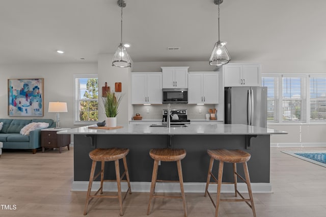 518 Toran Dr, Wake Forest, NC 27587 - kitchen featuring stainless steel appliances, a sink, tasteful backsplash, white cabinets, and recessed lighting