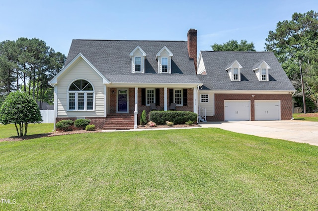 2709 Les Paul Ln, Apex, NC 27539 - new england style home featuring a chimney, covered porch, concrete driveway, a front lawn, and brick siding