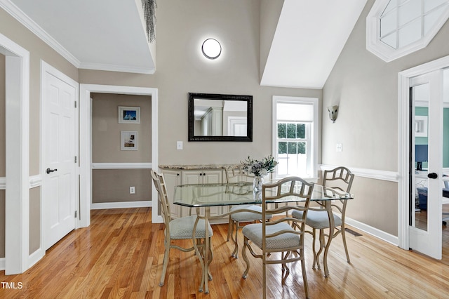 2709 Les Paul Ln, Apex, NC 27539 - dining space featuring light wood-type flooring, baseboards, lofted ceiling, and crown molding